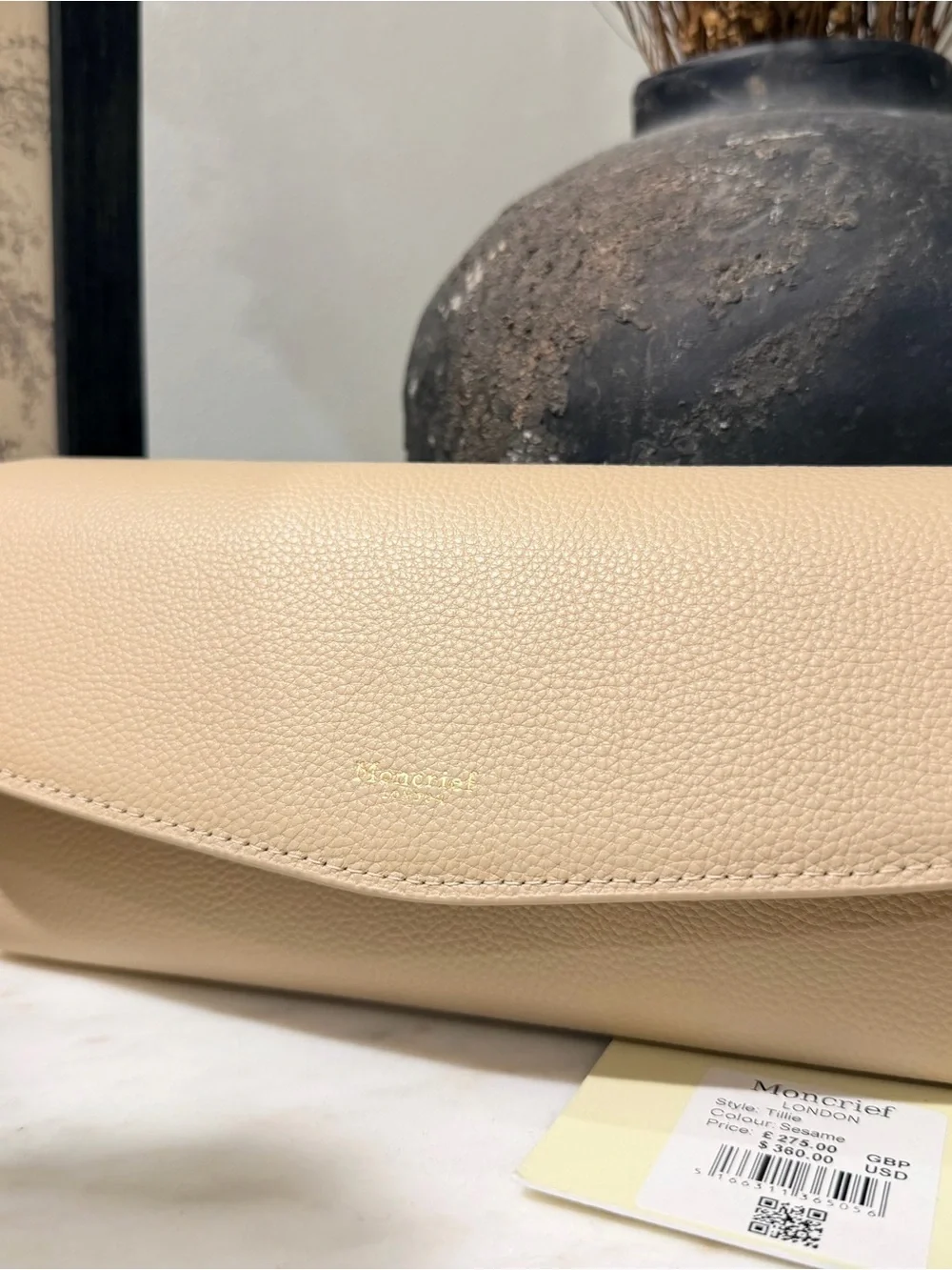 Moncrieff Beige Pebbled Leather Clutch